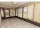 Bright sunroom with tile flooring, ceiling fan and exterior view at 5213 20Th Street E Ct, Bradenton, FL 34203