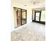 Relaxing sunroom with tile flooring, ceiling fan, offering tranquil views of the outdoors at 5213 20Th Street E Ct, Bradenton, FL 34203