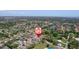 Captivating aerial shot of the neighborhood featuring serene lakes and tree-lined streets at 5410 Matthew Ct, Sarasota, FL 34231