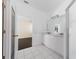 Bright bathroom featuring double sinks, white cabinets, and modern fixtures at 5410 Matthew Ct, Sarasota, FL 34231
