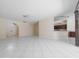 Open living space with tile flooring, high ceilings, and ample natural light at 5410 Matthew Ct, Sarasota, FL 34231