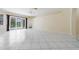 Spacious living area with tile floors, a ceiling fan, and a view of the pool at 5410 Matthew Ct, Sarasota, FL 34231