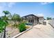 Screened-in pool offers privacy in a spacious backyard with lush landscaping at 5410 Matthew Ct, Sarasota, FL 34231