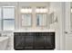 Modern bathroom with dual sink vanity, chrome fixtures, framed mirrors, and white countertop at 5515 69Th E Pl, Ellenton, FL 34222