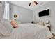 Bright bedroom featuring white furniture, light walls, and wood-style flooring at 5515 69Th E Pl, Ellenton, FL 34222