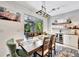 Dining room featuring a view to outdoor living, bar, and plank wall at 5515 69Th E Pl, Ellenton, FL 34222