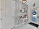 Entryway showcases tile flooring, wainscoting and a decorative entry table with an eye-catching initial at 5515 69Th E Pl, Ellenton, FL 34222