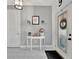 Inviting foyer features tile flooring, wainscoting and a decorative entry table with Gathering photos at 5515 69Th E Pl, Ellenton, FL 34222