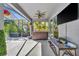 Relaxing hot tub located on the covered patio adjacent to the screened pool offers a luxurious outdoor experience at 5515 69Th E Pl, Ellenton, FL 34222