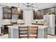 Kitchen featuring stainless steel appliances, granite countertops and dark cabinetry at 5515 69Th E Pl, Ellenton, FL 34222