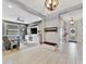 Open-concept living room featuring tile floors, modern lighting, and neutral paint at 5515 69Th E Pl, Ellenton, FL 34222