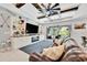 Comfortable living room with large built-ins, ceiling beams and lots of natural light at 5515 69Th E Pl, Ellenton, FL 34222