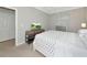 Bedroom with carpeted flooring, side tables and natural light from the large window at 5604 Palmer Cir # 103, Bradenton, FL 34211