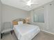 Bedroom featuring soft carpet, a chair, window with blinds, and a ceiling fan at 5604 Palmer Cir # 103, Bradenton, FL 34211