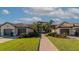 Beautiful exterior view of a home with meticulous landscaping and inviting curb appeal at 5604 Palmer Cir # 103, Bradenton, FL 34211