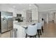 Modern kitchen featuring stainless steel appliances, granite countertops, and bar-style seating at 5604 Palmer Cir # 103, Bradenton, FL 34211