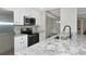 Elegant kitchen showcasing granite countertops, stainless steel appliances, and white cabinetry at 5604 Palmer Cir # 103, Bradenton, FL 34211