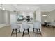 Open-concept kitchen with granite countertops, stainless steel appliances, and bar seating at 5604 Palmer Cir # 103, Bradenton, FL 34211