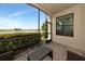 Relaxing lanai with seating and views of the lake and manicured landscaping for a serene outdoor experience at 5604 Palmer Cir # 103, Bradenton, FL 34211