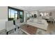 Open-concept living room and kitchen with stainless steel appliances and a view of the lanai at 5604 Palmer Cir # 103, Bradenton, FL 34211