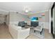 The living room offers a comfortable seating arrangement with a tv and sliding glass door at 5604 Palmer Cir # 103, Bradenton, FL 34211
