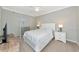 Bright main bedroom includes soft carpet and windows for natural light and neutral paint at 5604 Palmer Cir # 103, Bradenton, FL 34211