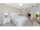 Spacious main bedroom boasts soft carpet, en-suite bathroom, and bright natural light at 5604 Palmer Cir # 103, Bradenton, FL 34211
