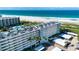 Aerial view of the building with beachfront access at 5750 Midnight Pass Rd # 203, Sarasota, FL 34242
