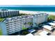 Aerial view of the building with beachfront access at 5750 Midnight Pass Rd # 203, Sarasota, FL 34242