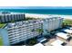 Aerial view of the building with beachfront access at 5750 Midnight Pass Rd # 203, Sarasota, FL 34242
