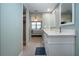 Bathroom featuring double sinks and a view into the bedroom at 5750 Midnight Pass Rd # 203, Sarasota, FL 34242