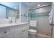 Updated bathroom with a glass-enclosed shower and modern sink at 5750 Midnight Pass Rd # 203, Sarasota, FL 34242