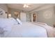 Comfortable bedroom with large bed and view to open doorway to ensuite bathroom at 5750 Midnight Pass Rd # 203, Sarasota, FL 34242