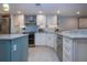 Open concept kitchen with updated appliances, ample counter space, and stylish backsplash at 5750 Midnight Pass Rd # 203, Sarasota, FL 34242
