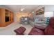 Bright living room featuring plush gray sectional sofa and stylish furniture with modern decor at 5750 Midnight Pass Rd # 203, Sarasota, FL 34242