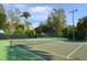 Well maintained outdoor tennis courts surrounded by lush greenery at 5880 Midnight Pass Rd # 202, Sarasota, FL 34242
