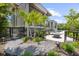 Landscaped backyard featuring a fire pit, pool, and modern architectural design at 590 De Narvaez Dr, Longboat Key, FL 34228