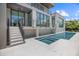 Home backyard with pool and hot tub, offering a luxurious outdoor experience at 590 De Narvaez Dr, Longboat Key, FL 34228