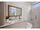 Stylish bathroom features a glass shower, neutral finishes, and a framed mirror at 590 De Narvaez Dr, Longboat Key, FL 34228