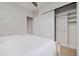 Bedroom featuring a closet with sliding doors, complementing the room's clean and modern design at 590 De Narvaez Dr, Longboat Key, FL 34228