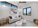 Bright living room filled with natural light, contemporary furnishings, and scenic outdoor views at 590 De Narvaez Dr, Longboat Key, FL 34228