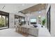 Bright living room with high ceilings, sleek furniture, and large windows that offer great views at 590 De Narvaez Dr, Longboat Key, FL 34228