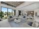 Spacious living room boasts a large sectional sofa, elegant decor, and an open floor plan at 590 De Narvaez Dr, Longboat Key, FL 34228
