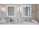 Close-up of the marble countertop in this bathroom featuring unique mirrors, sinks, and stylish fixtures at 590 De Narvaez Dr, Longboat Key, FL 34228