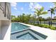 Inviting pool and spa overlooking lush landscaping and serene waterway views at 590 De Narvaez Dr, Longboat Key, FL 34228