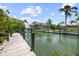 Scenic view of waterway from the wooden dock showcasing serene waterfront living at 590 De Narvaez Dr, Longboat Key, FL 34228