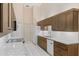 Modern kitchen with granite countertops, stainless steel appliances, and ample storage space at 6755 Approach Rd # 31, Sarasota, FL 34238