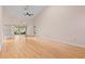 Large living room with wood floors, neutral paint, and access to the lanai at 6755 Approach Rd # 31, Sarasota, FL 34238
