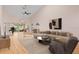 Bright living room boasting high ceilings, hardwood floors, and stylish modern furniture at 6755 Approach Rd # 31, Sarasota, FL 34238