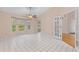 Bright room with tiled floor, large windows and ceiling fan at 6755 Approach Rd # 31, Sarasota, FL 34238